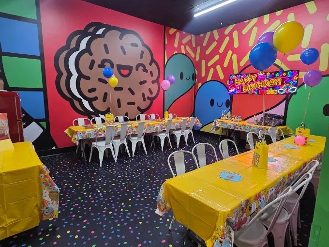 FUNBOX private party room with character murals, balloons and set tables