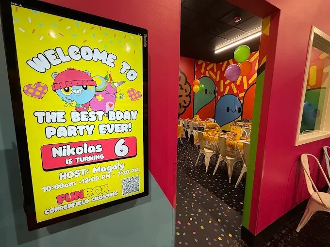 Personalized welcome screen outside a FUNBOX party room reading Welcome to the best bday party ever
