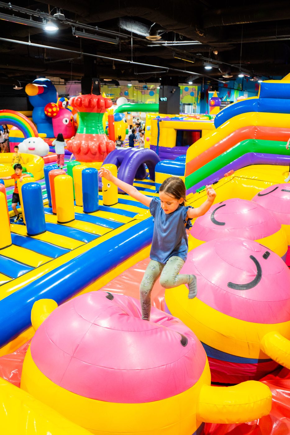 Kids running the inflatable obstacle course at FUNBOX Houston