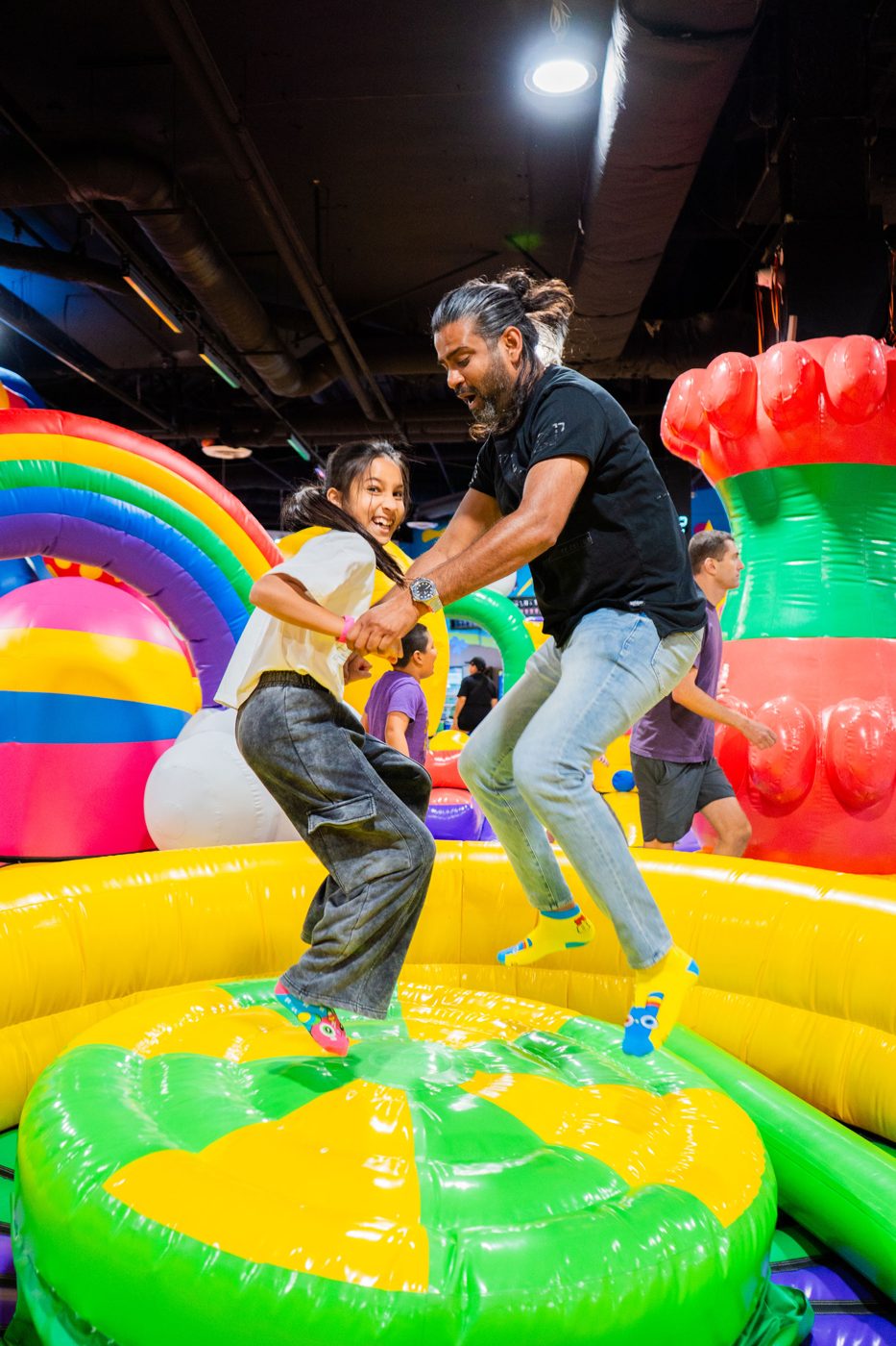 Kids and parents bouncing at FUNBOX Houston