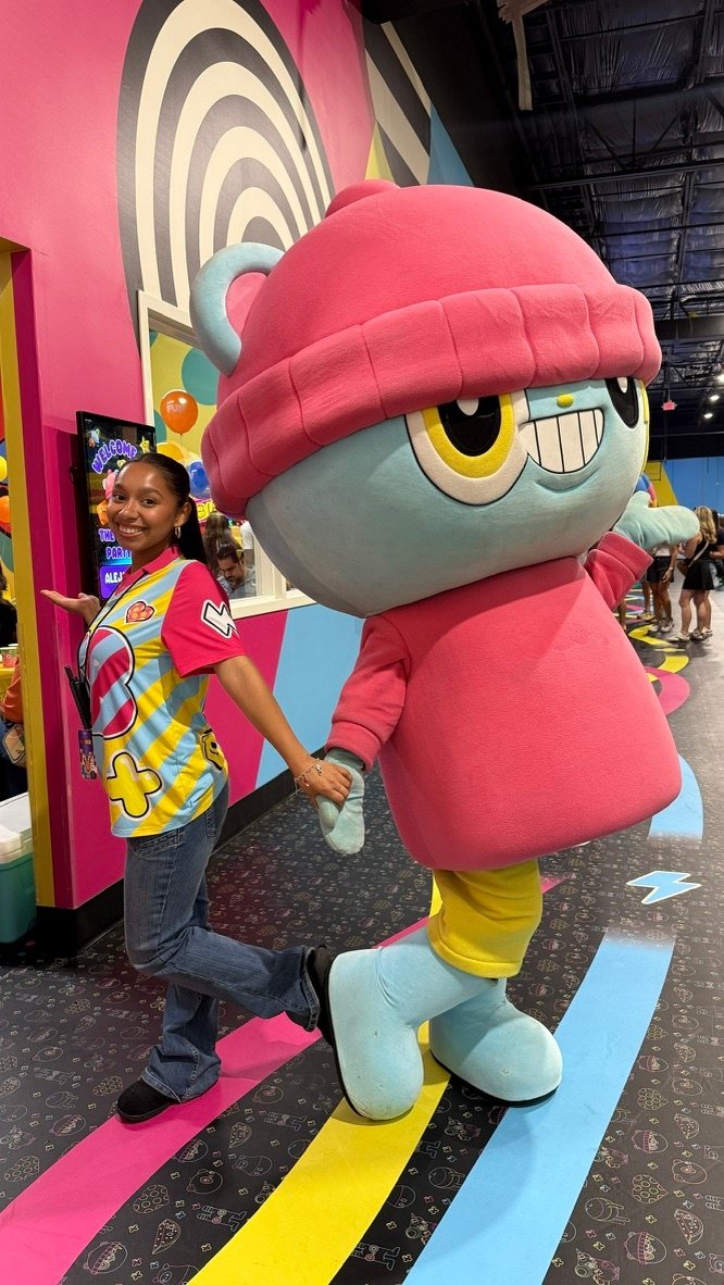 FUNBOX team member walking with the FUNBOX mascot